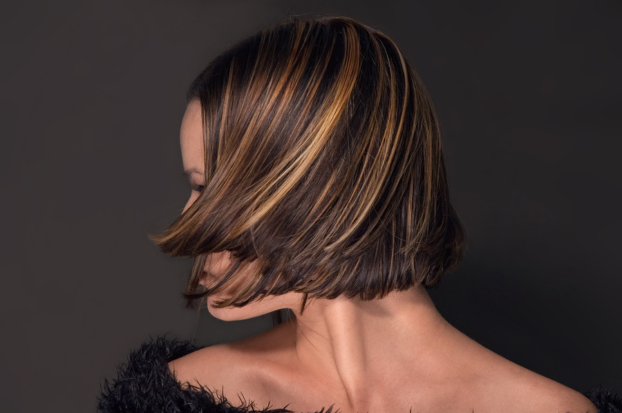 Woman In Hair Salon With Coloring Foil On Her Head Stock Photo